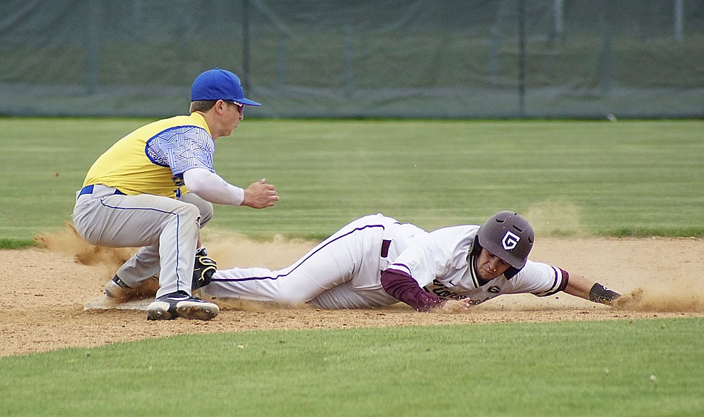 Westside Eagle Observer/RANDY MOLL
Gentry's Jonathan Corter slides into the Cedarville tag in an attempt to steal second base at the Merrill Reynolds Memorial Complex at Gentry High School on Thursday.