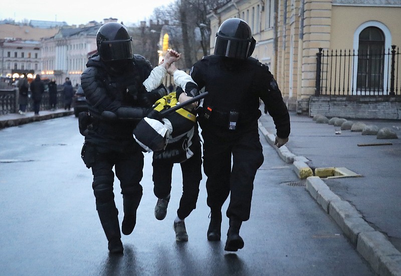 Police detain a man during a protest in support of jailed opposition leader Alexei Navalny in St. Petersburg, Russia, Wednesday, April 21, 2021. A human rights group that monitors political repression said at least 400 people were arrested across the country in connection with the protests. Many were seized before protests even began, including two top Navalny associates in Moscow. (AP Photo/Dmitri Lovetsky)