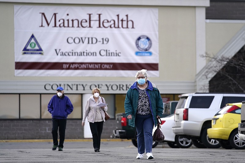 FILE - In this March 3, 2021, file photo, senior citizens leave a covid-19 vaccination site operated by Maine Health in the site of a former department store in Sanford, Maine. Demand for the coronavirus vaccine has fallen off in some places around the U.S., to the point where some counties are turning down new shipments of doses. (AP Photo/Robert F. Bukaty, File)