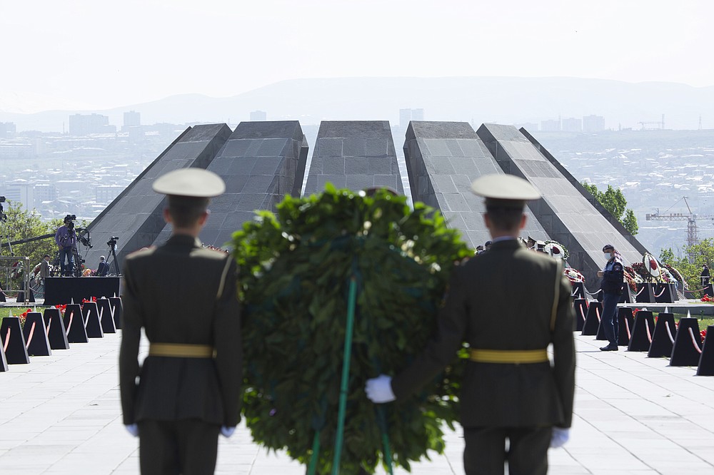 Armenian honor guards attend a memorial service at the monument to the victims of mass killings by Ottoman Turks, to commemorate the 106th anniversary of the massacre, in Yerevan, Armenia, Saturday, April 24, 2021. Armenians marked the anniversary of the death of up to 1.5 million Armenians by Ottoman Turks, an event widely viewed by scholars as genocide, though Turkey refutes the claim. (Grigor Yepremyan/PAN Photo via AP)
