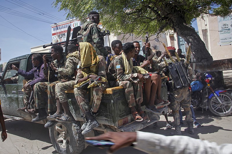 Military forces supporting anti-government opposition groups drive on a street in the Fagah area of Mogadishu, Somalia Sunday, April 25, 2021. Gunfire was exchanged Sunday between government forces loyal to President Mohamed Abdullahi Mohamed, who signed into law on April 14 a two year extension of his mandate and that of his government, and other sections of the military opposed to the move and sympathetic to former presidents Hassan Sheikh Mohamud and Sharif Sheikh Ahmed. (AP Photo/Farah Abdi Warsameh)