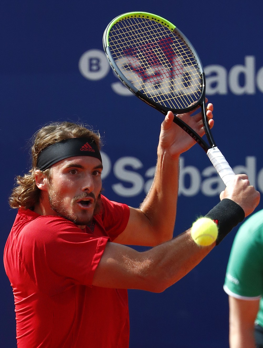 Stefanos Tsitsipas of Greece returns the ball to Rafael Nadal of Spain during the final Godo tennis tournament in Barcelona, Spain, Sunday, April 25, 2021. (AP Photo/Joan Monfort)