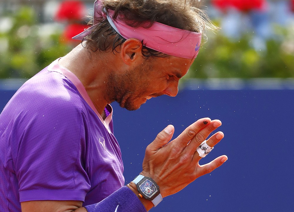 Rafael Nadal of Spain reacts during the final Godo tennis tournament against Stefanos Tsitsipas of Greece in Barcelona, Spain, Sunday, April 25, 2021. (AP Photo/Joan Monfort)