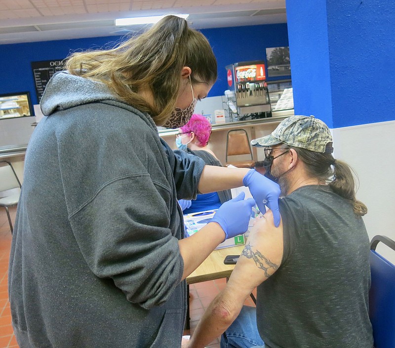 Westside Eagle Observer/ SUSAN HOLLAND
Gary Biddle, of Pineville, Mo., gets his covid-19 vaccine shot from RN Alicia Boone at a covid vaccine clinic at Ozarks Community Hospital in Gravette Thursday afternoon, April 29. OCH will be conducting another vaccine clinic Thursday, May 6. Contact Melissa Bradley at mbradley@ochonline.com or call 479-787-5291 to reserve a spot.