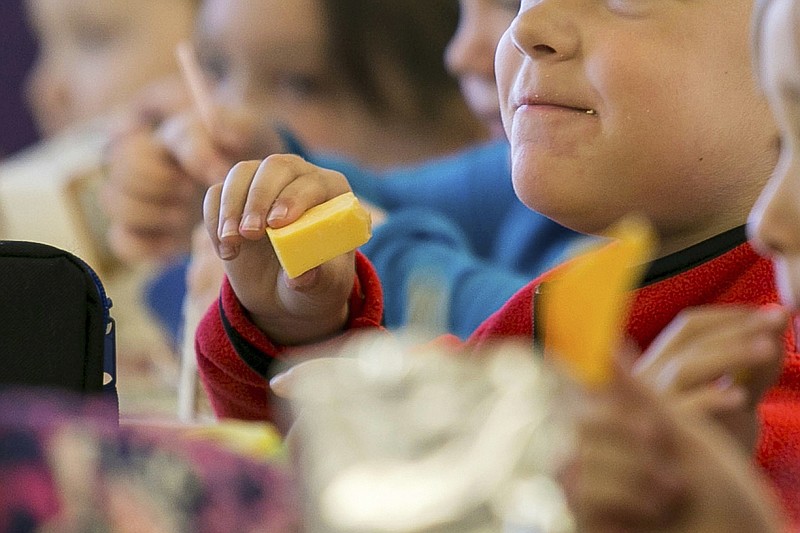 FILE - In this Monday, Oct. 29, 2018, file photo, kids eat lunch at an elementary school in Paducah, Ky. (Ellen O'Nan/The Paducah Sun via AP, File)