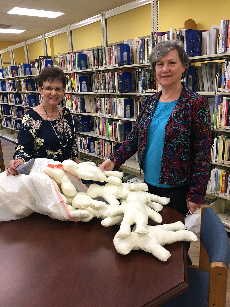 Willing Workers of White Hall President Sarah Payton (left) is collecting dolls made by member Ellen Bauer. The items will be part of a donation of about 100 dolls to the Arkansas Children's Hospital at Little Rock. (Special to The Commercial)
