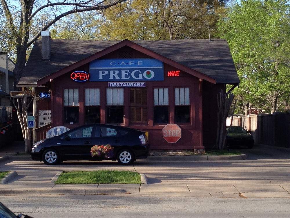 The sale of the former Cafe Prego at 5510 Kavanaugh Blvd., in Little Rock's Pulaski Heights, includes the building's contents that created a riotous decor that covered the walls and filled the entryway and dining areas. (Democrat-Gazette file photos)