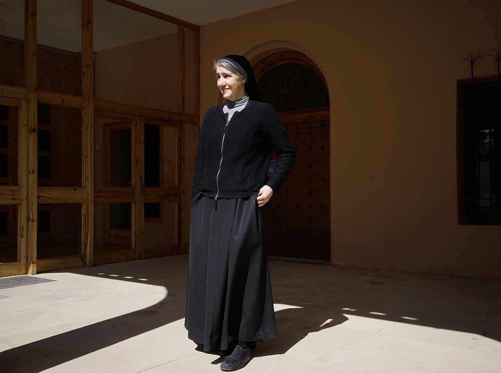 Sister Teresa Forcades, a Catholic nun and a doctor, outside the monastery where she lives in Montserrat, Spain, March 22, 2021. Forcades, Spain’s most famous Catholic nun, is one of Europe’s longstanding vaccine skeptics, finds herself at odds with governments, medical experts and even Pope Francis. (Samuel Aranda/The New York Times)