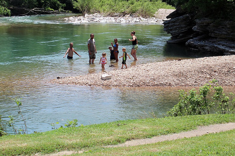 MEGAN DAVIS/MCDONALD COUNTY PRESS Many families took to the shores of Indian Creek to beat the heat on in 2019. Kids were swimming, splashing and squealing with excitement.