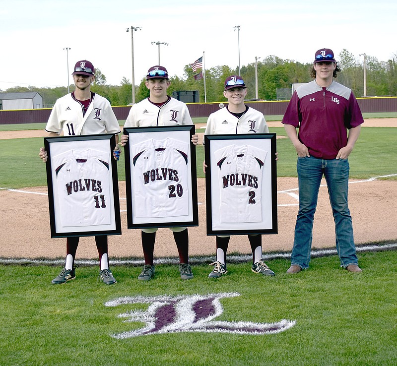 Submitted photo/Lincoln honored its 2021 baseball seniors (from left): Cody Webb, Noah Moore, Weston Massey and Mason Beeks, during pregame ceremonies on Monday, April 26. The Wolves won the game 7-6 with a thrilling two-out walked in run over Life Way Christian in the bottom of the seventh inning.