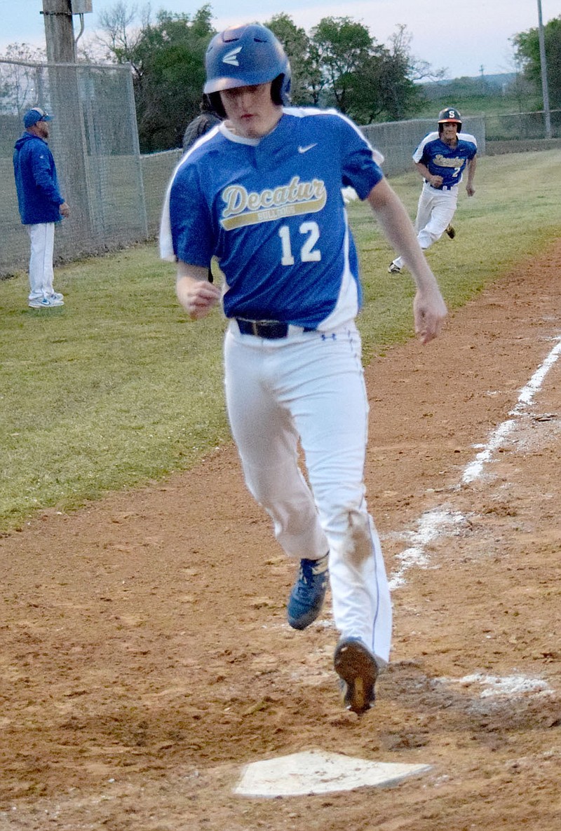 Westside Eagle Observer/MIKE ECKELS
Senior Bryson Funk crosses home plate beginning a three run rally during the Decatur-Yellville baseball game in Decatur April 21. The Bulldogs ended their 2021 baseball season with a loss to Cotter in the April 29 2A-1 district tournament in Flippin.