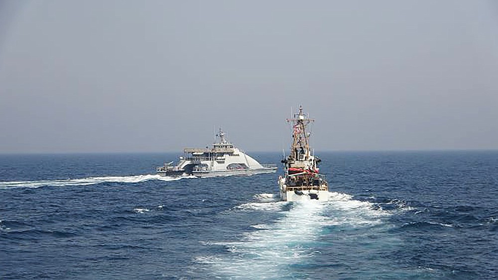 In an April 2, 2021, photo released by the U.S. Navy, an Iranian Revolutionary Guard vessel cuts in front of the U.S. Coast Guard ship USCGC Monomoy in the Persian Gulf. American and Iranian warships had a tense encounter in the Persian Gulf earlier this month, the first such incident in about a year amid wider turmoil in the region over Tehran's tattered nuclear deal, the U.S. Navy said Tuesday, April 27, 2021. (U.S. Navy via AP)