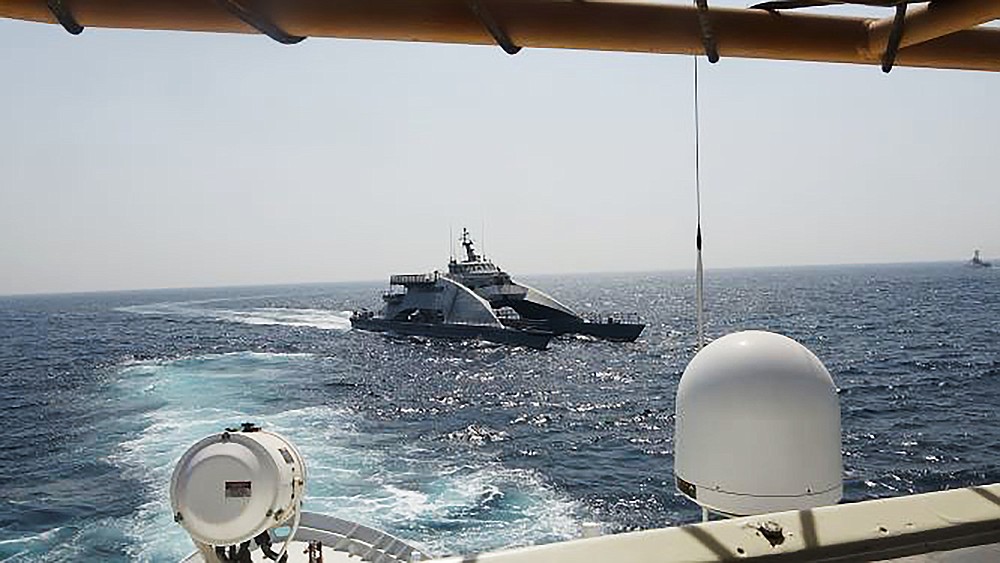In an April 2, 2021, photo released by the U.S. Navy, an Iranian Revolutionary Guard vessel cuts in front of the U.S. Coast Guard ship USCGC Wrangell in the Persian Gulf. American and Iranian warships had a tense encounter in the Persian Gulf earlier this month, the first such incident in about a year amid wider turmoil in the region over Tehran's tattered nuclear deal, the U.S. Navy said Tuesday, April 27, 2021. (U.S. Navy via AP)