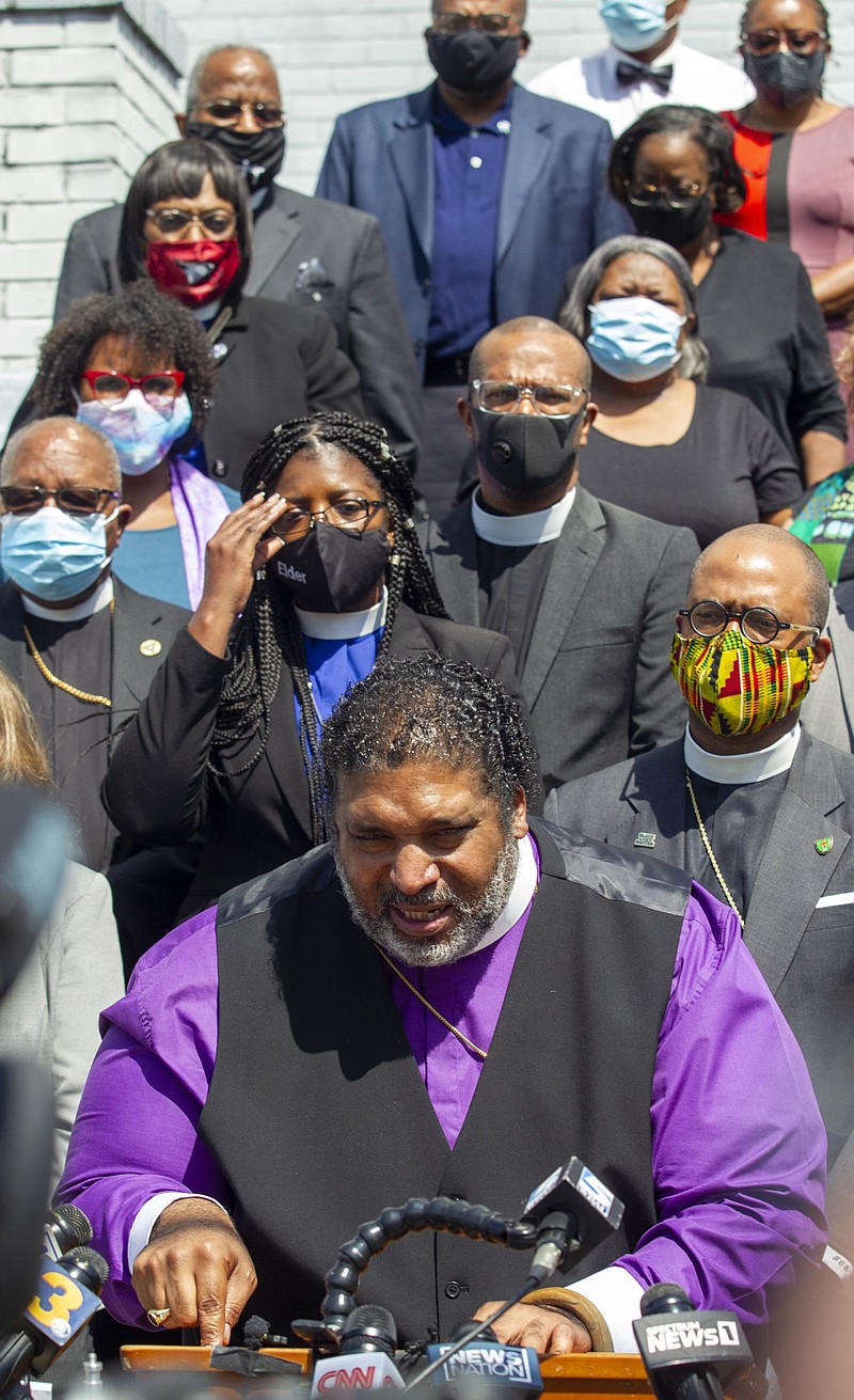 Rev. William Barber II speaks as the North Carolina NAACP and clergy urge state attorney general Josh Stein to take over the investigation into the police shooting death of Andrew Brown Jr. during a press conference at the Mt. Lebanon AME Zion Church, Tuesday, April 27, 2021, in Elizabeth City, N.C. The FBI launched a civil rights probe Tuesday into the death of Andrew Brown Jr., a Black man killed by deputies in North Carolina, as his family released an independent autopsy showing he was shot five times, including in the back of the head. (Travis Long/The News & Observer via AP)