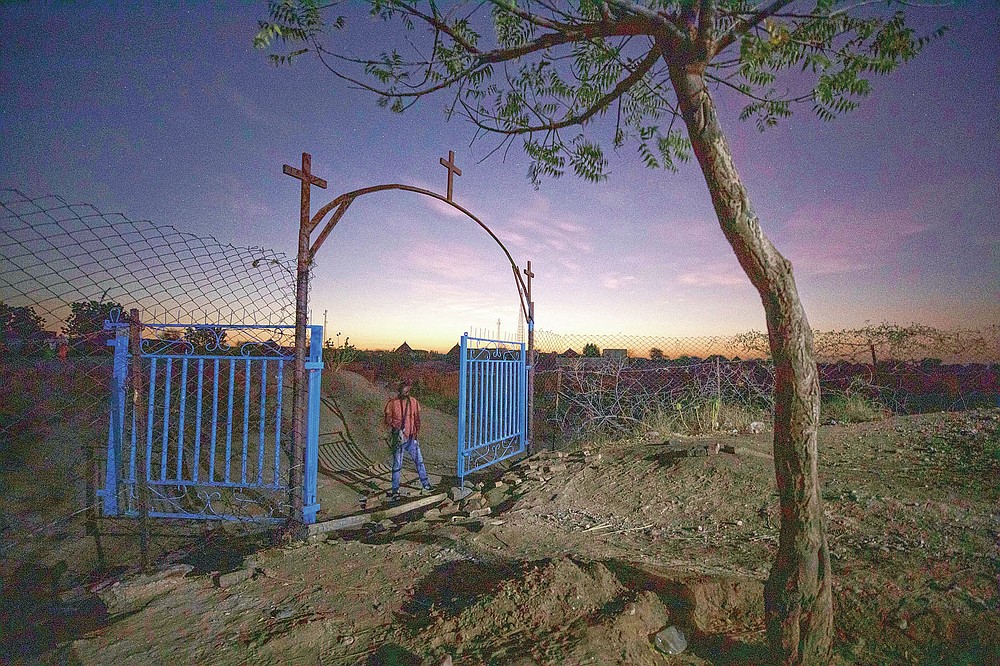 A gate stands open at the church where Tigrayan refugee Abraha Kinfe Gebremariam, 40, prays in Hamdayet, eastern Sudan, near the border with Ethiopia, on March 21, 2021. More than 62,000 refugees from Ethiopia’s embattled Tigray region are in Sudan. (AP Photo/Nariman El-Mofty)