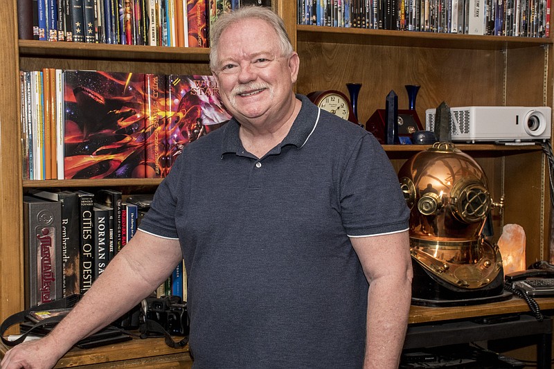 Writer and pulp magazine collector Michael Tierney has helped rescue “The Cosmic Courtship,” a long-lost sci-fi adventure tale from 1917 by Julian Hawthorne, and has joined with Little Rock’s Cirsova Publishing to re-publish the story. (Arkansas Democrat-Gazette/Cary Jenkins)