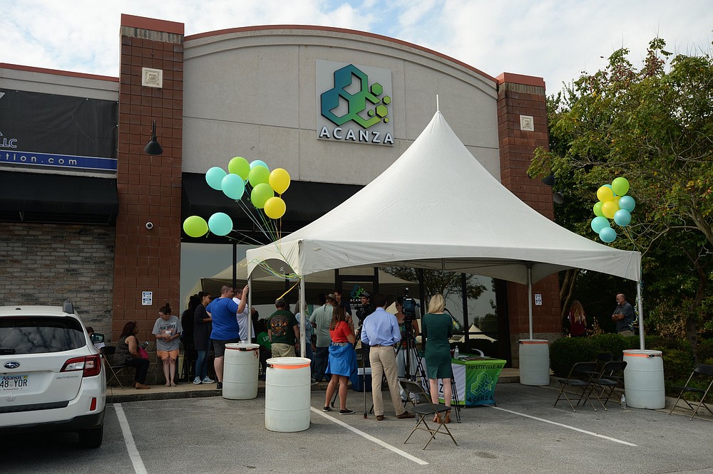 Residents wait in line Sept. 14, 2019, as Acanza, the first medical marijuana dispensary in Fayetteville, opens for the first time. (NWA Democrat-Gazette file photo/Andy Shupe)