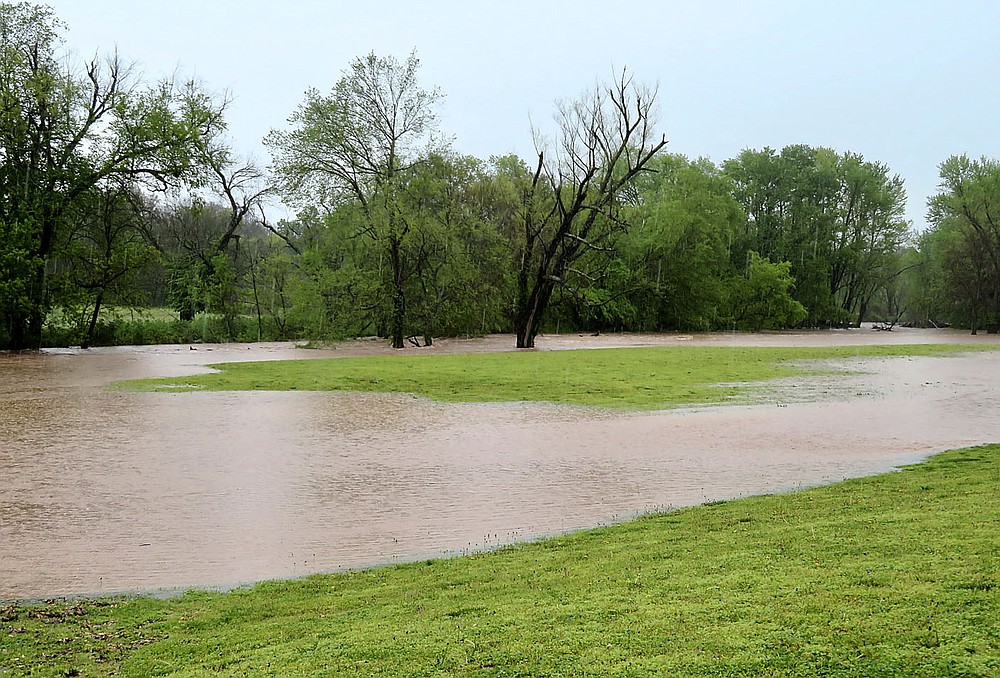 Westside Eagle Observer/RANDY MOLL
Floodwaters swelled over the banks of Flint Creek on the east side of the new Dawn Hill East bridge in Gentry on Wednesday morning. City workers were keeping an eye on the flooded creek and the bridge, with more rains anticipated before the storms move off.