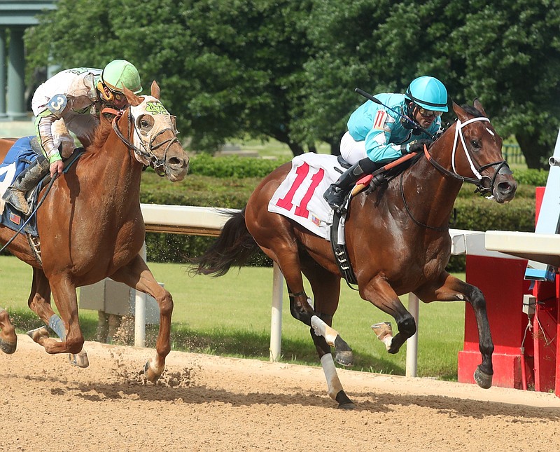 Jockey Joel Rosario and Man in the Can (11), right, outlast jockey Calvin Borel and KJ’s Nobility (3) to the wire to win the Arkansas Breeders Championship at Oaklawn on May 1, 2020. - Photo by Richard Rasmussen of The Sentinel-Record
