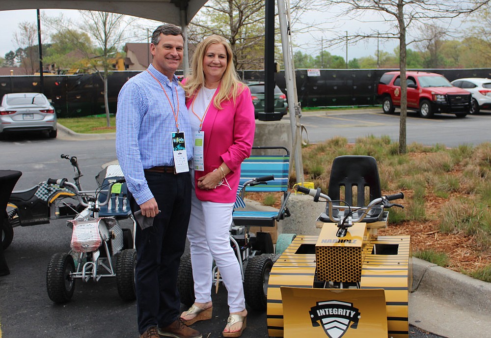 Michael and Laura Parker stand by the Nabholz 24-volt Zing Cup race entrant at the UnGala on April 24.
(NWA Democrat-Gazette/Carin Schoppmeyer)