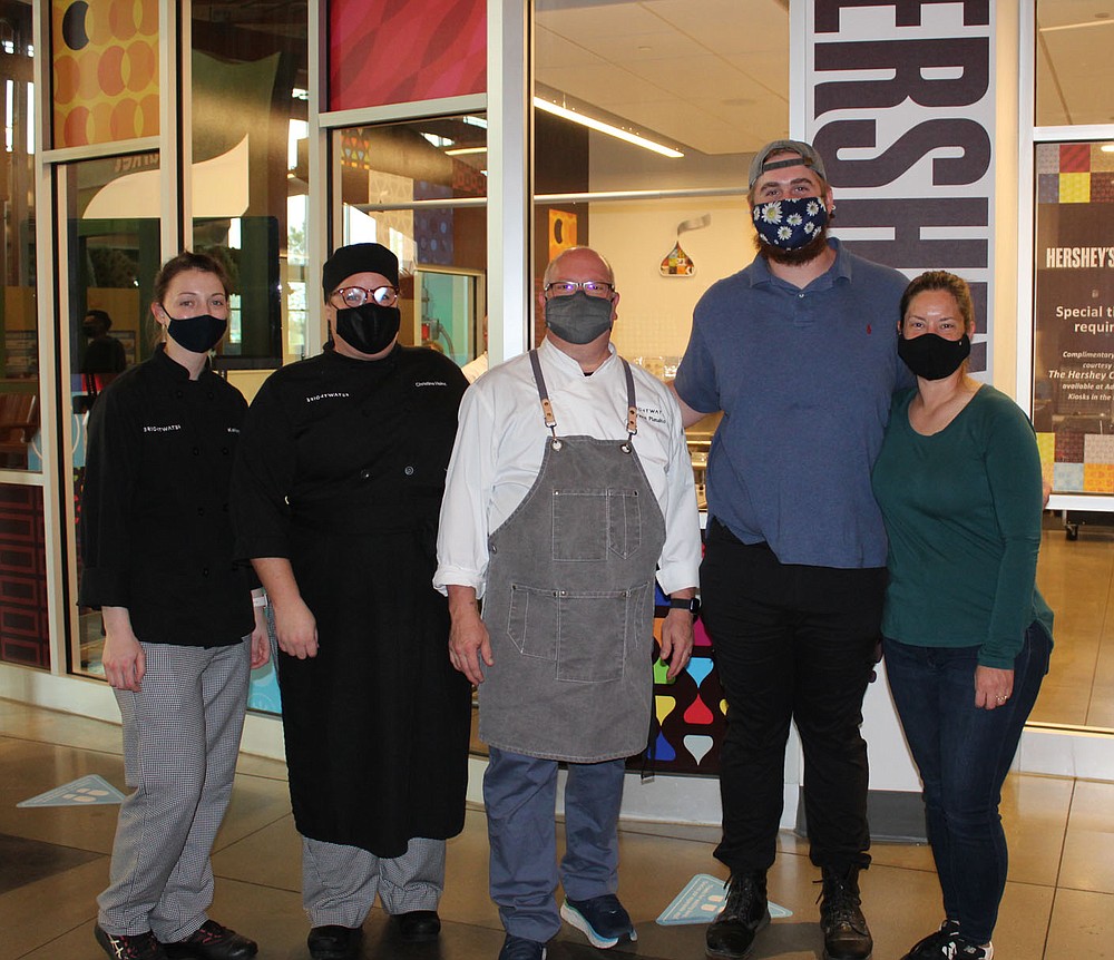 Kelsey Meziere (from left), Christine Heinz, Vince Pianalto, Nathan Dosa and Sandi Macklon take a break from cooking at the UnGala.
(NWA Democrat-Gazette/Carin Schoppmeyer)