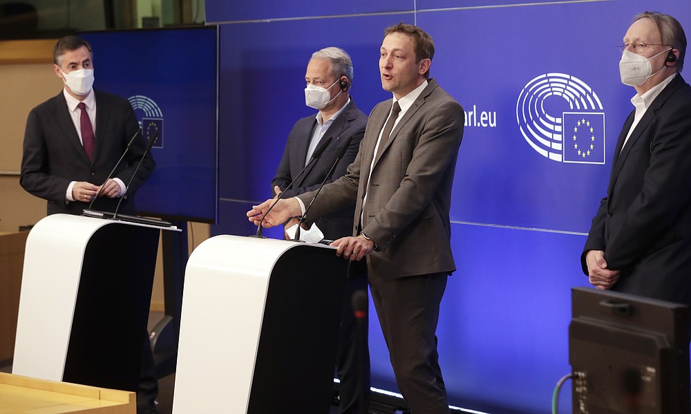 From left, Members of European Parliament, David McAllister, Andreas Schieder, Christophe Hansen and Bernd Lange participate in a media conference after a debate on the EU-UK trade and cooperation agreement at the European Parliament in Brussels, Tuesday, April 27, 2021. (Olivier Hoslet, Pool via AP)