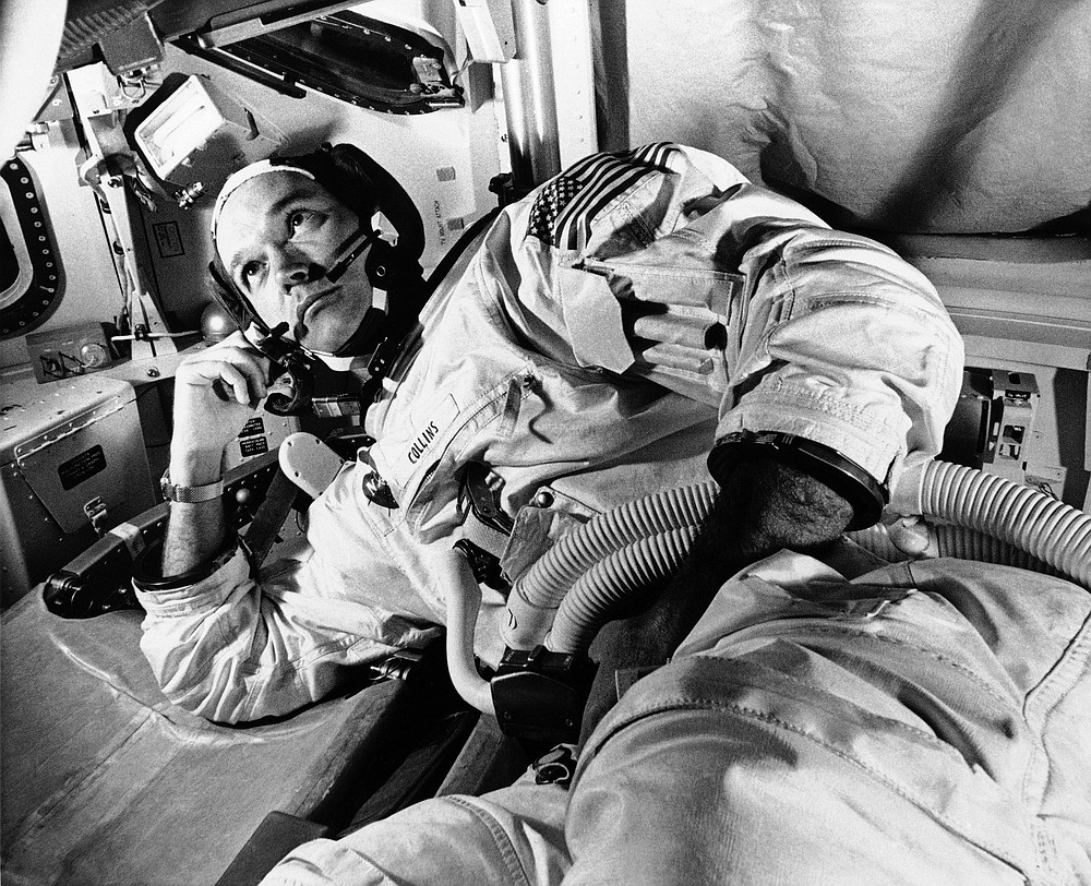 FILE - In this June 19, 1969 file photo, Apollo 11 command module pilot astronaut Michael Collins takes a break during training for the moon mission, in Cape Kennedy, Fla. Collins, who piloted the ship from which Neil Armstrong and Buzz Aldrin left to make their historic first steps on the moon in 1969, died Wednesday, April 28, 2021, of cancer, his family said. He was 90. (AP Photo/File)