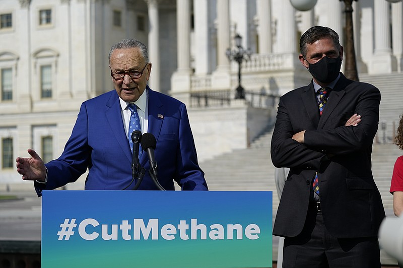 Senate Majority Leader Chuck Schumer, D-N.Y., joined by Sen. Martin Heinrich, D-N.M., right, talks about legislation to re-impose critical regulations to reduce methane pollution from oil and gas wells, at the Capitol in Washington, Wednesday, April 28, 2021. (AP Photo/J. Scott Applewhite)