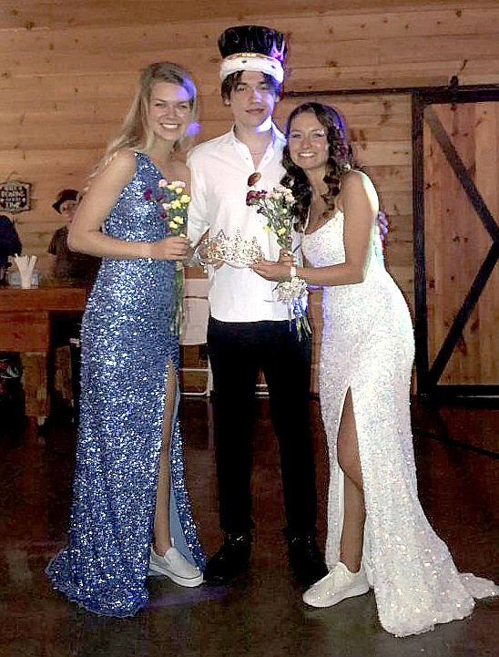 SUBMITTED
Isaiah Lopez (center) was chosen as Gentry's prom king and, due to a tie, Megan McCollum and Ashlyn Little were both prom queens at the 2021 Gentry junior-senior prom, held at the Cypress Barn in Siloam Springs on April 23.