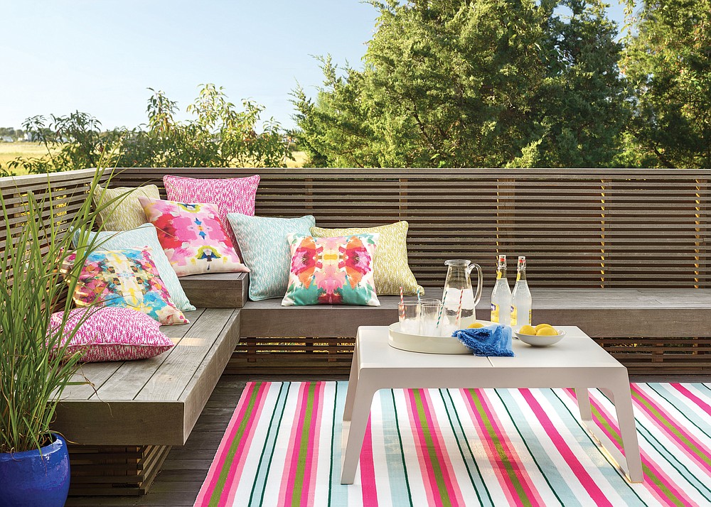 For outdoor rugs, Marnie Oursler recommends Dash & Albert, including the watermelon striped handmade flatweave indoor/outdoor area rug (from $54). (Courtesy Wayfair via The Washington Post)