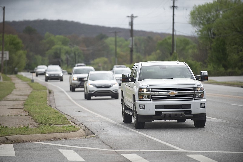 Traffic flows Thursday April 29, 2021 on Arkansas 16 near Stone Bridge Rd. The Arkansas Department of Transportation has completed a study of Arkansas 16 and is recommending widening the road to four lanes, in four phases, from Stone Bridge Road in Fayetteville to the intersection with Arkansas 74 in Elkins. Arkansas 16 provides one of the only Middle Fork White River crossings in the general area south of Lake Sequoyah, according to the study. The total estimated cost of the improvements would be about $45.2 million, in 2020 dollars, of which about $29 million would be construction costs. The total cost includes preliminary engineering, right-of-way acquisition, utilities relocation, construction, and construction engineering.Visit nwaonline.com/210430Daily/ and nwadg.com/photo. (NWA Democrat-Gazette/J.T. Wampler)