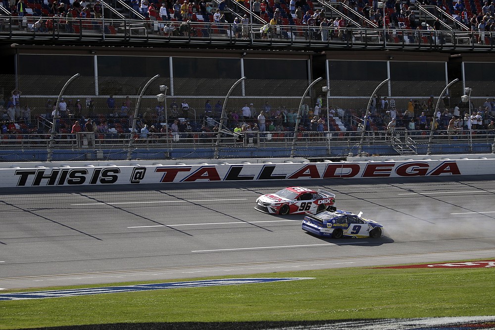 NASCAR Cup Series driver Chase Elliott (9) spins out as NASCAR driver Harrison Burton passes him during the Geico 500 NASCAR Sprint Cup auto race at Talladega Superspeedway Sunday, April 25, 2021 in Talladega, Ala. (AP Photo/Butch Dill)