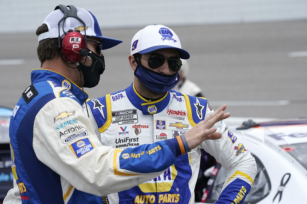 Chase Elliott, right, talks to his crew chief, Alan Gustafson, left, prior to the start of the NASCAR Cup Series auto race at Richmond International Raceway in Richmond, Va., Sunday, April 18, 2021. (AP Photo/Steve Helber)