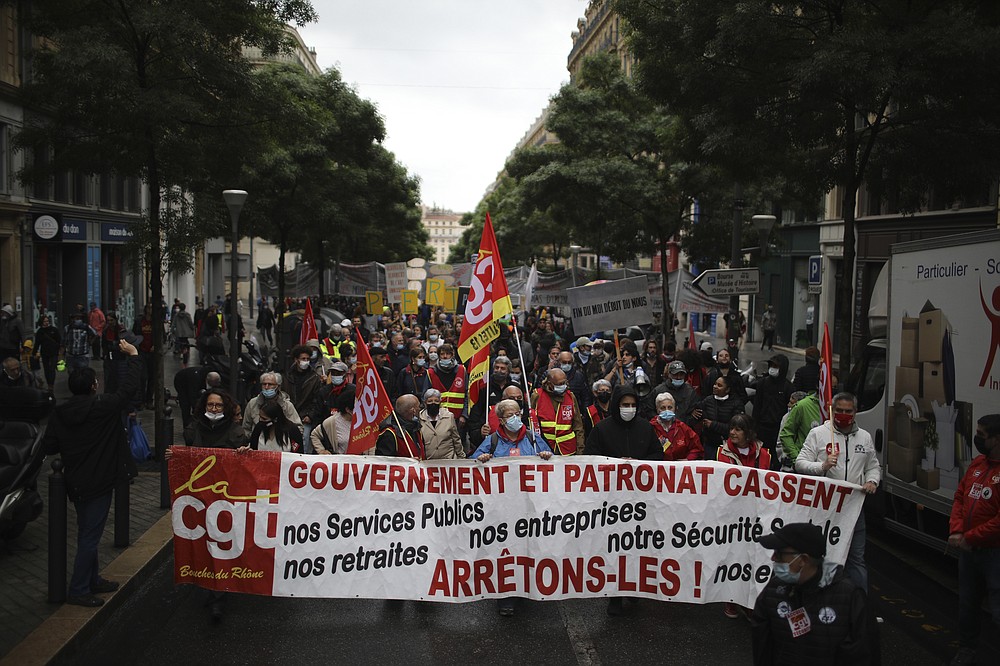 Workers of the leftist union CGT (General Work Confederation) demonstrate on May Day in Marseille, southern France, Saturday, May 1, 2021. (AP Photo/Daniel Cole)