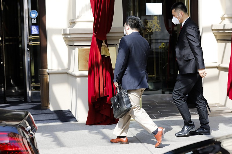 The ambassador of the Permanent Mission of the People's Republic of China to the United Nations, Wang Qun, enters the 'Grand Hotel Wien' where closed-door nuclear talks with Iran take place in Vienna, Austria, Saturday, May 1, 2021. (AP Photo/Lisa Leutner)