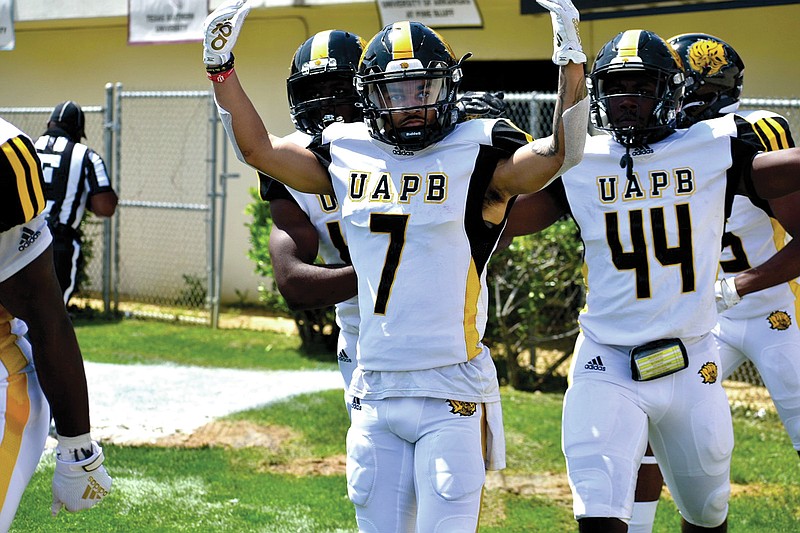 UAPB return specialist Tyrin Ralph celebrates his 81-yard touchdown kickoff return with Monroe Beard III in the first quarter of the SWAC championship game Saturday, May 1, 2021. (Pine Bluff Commercial/I.C. Murrell)