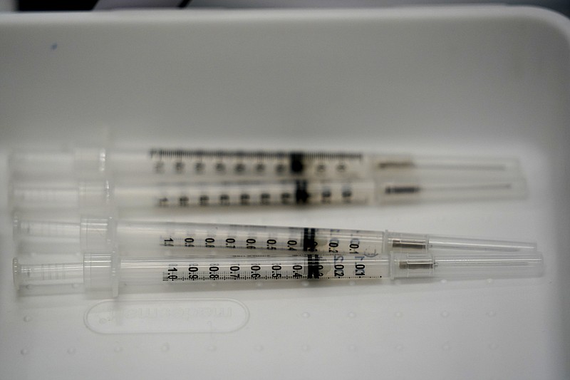 FILE - This April 15, 2021, file photo syringes filled with the Pfizer COVID-19 vaccine are shown at the Christine E. Lynn Rehabilitation center in Jackson Memorial hospital in Miami. With vaccination rates lagging in red states, Republican leaders have begun stepping up efforts to persuade their supporters to get the shot, at times combating misinformation spread by some of their own.  (AP Photo/Wilfredo Lee, File)