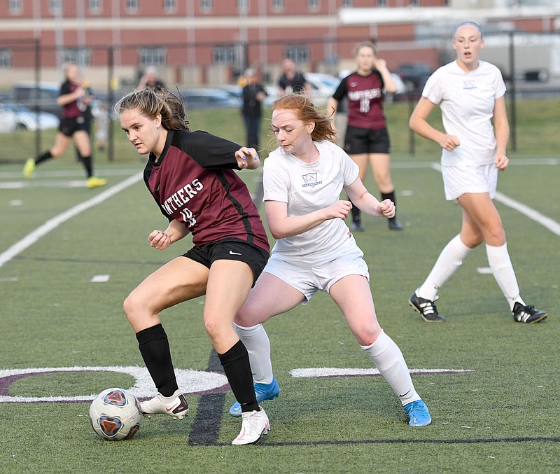 Bud Sullins/Special to the Herald-Leader
Siloam Springs senior Bri Anderson battles a Greenbrier player for possession of the ball during the two teams' game on April 26. Anderson leads the Lady Panthers with 21 goals on the season.