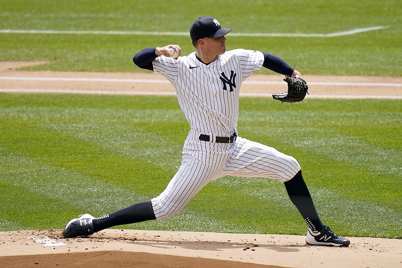 New York Yankees starting pitcher Corey Kluber throws during the first inning of a baseball game against the Detroit Tigers at Yankee Stadium, Sunday, May 2, 2021, in New York. (AP Photo/Seth Wenig)