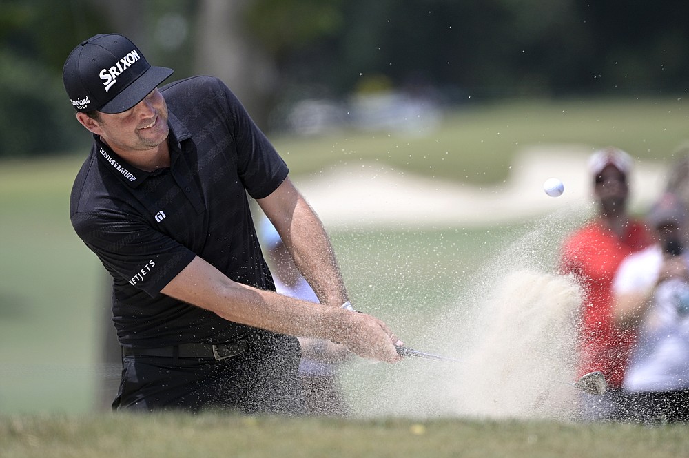 Keegan Bradley hits from a bunker onto the third green during the final round of the Valspar Championship golf tournament, Sunday, May 2, 2021, in Palm Harbor, Fla. (AP Photo/Phelan M. Ebenhack)