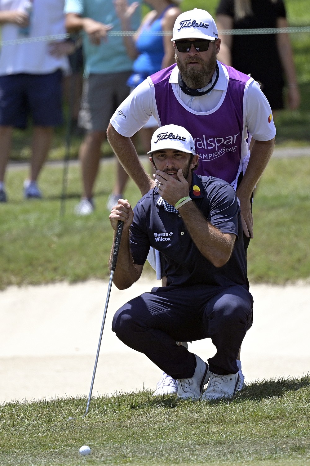 Max Homa, front, and his caddie line up a shot on the fringe of the first green during the final round of the Valspar Championship golf tournament, Sunday, May 2, 2021, in Palm Harbor, Fla. (AP Photo/Phelan M. Ebenhack)
