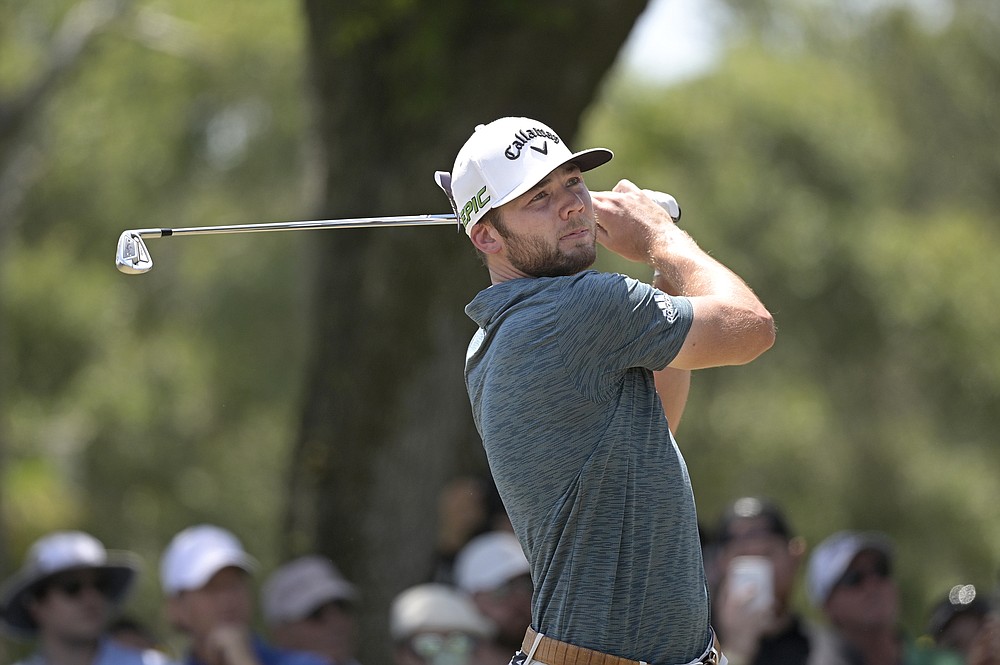 Sam Burns watches his tee shot on the second hole during the final round of the Valspar Championship golf tournament, Sunday, May 2, 2021, in Palm Harbor, Fla. (AP Photo/Phelan M. Ebenhack)