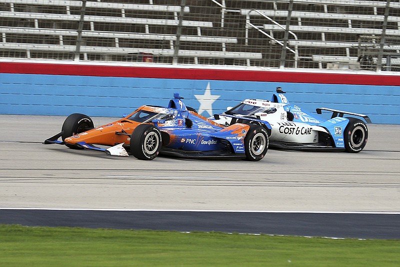 Scott Dixon tries to hold off Graham Rahal during an IndyCar Series auto race at Texas Motor Speedway on Sunday, May 2, 2021, in Fort Worth, Texas. (AP Photo/Richard W. Rodriguez)