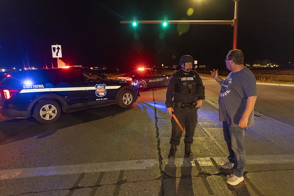 A State Patrol officer blocks the road in front of the Oneida Bingo and Casino in Green Bay, Wis on Saturday May 1, 2021 after reports of an active shooter. A spokesperson for a Wisconsin casino says an undetermined number of people have been shot at the casino. The Oneida Casino in Green Bay tweeted Saturday there was an active shooter at the casino. (AP Photo/Mike Roemer)