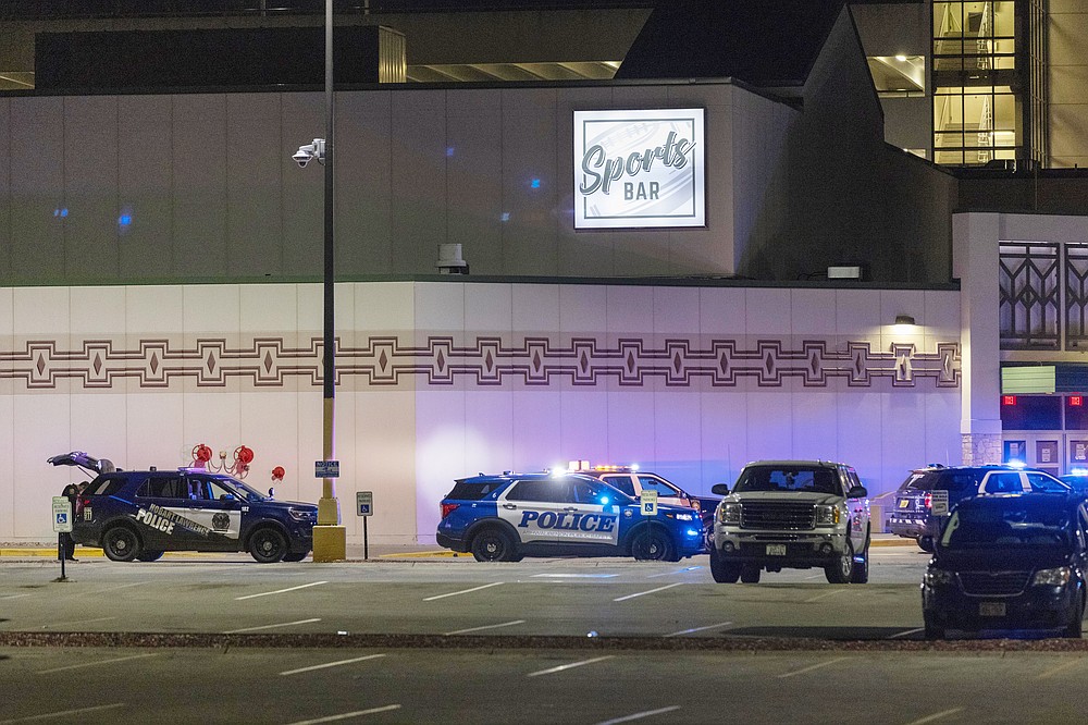 Police line the parking lot outside the Oneida Casino in the early morning hours of Sunday, May 2nd, 2021, near Green Bay, Wisconsin. Authorities in Wisconsin say a gunman killed two people at a Green Bay casino restaurant and seriously wounded a third before he was shot and killed by police Saturday. (AP Photo/Mike Roemer)