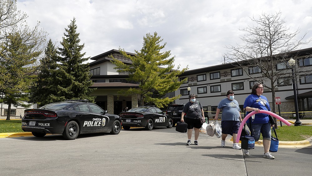 Guests leave the Oneida Casino/Radisson Hotel & Conference Center on Sunday, May 2, 2021 after a shooting took place on Saturday at the Duck Creek Restaurant in Ashwaubenon, Wis. (Sarah Kloepping/The Post-Crescent via AP)