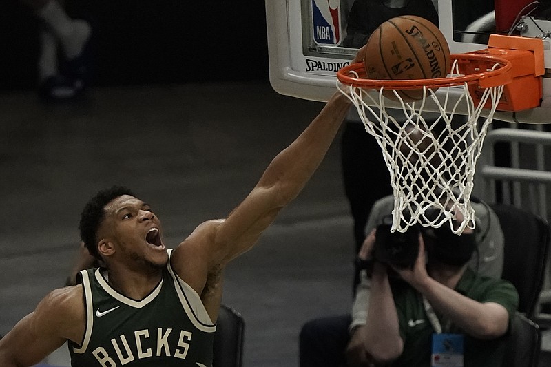 Milwaukee Bucks' Giannis Antetokounmpo dunks during the first half of Sunday's game against the Brooklyn Nets in Milwaukee. - Photo by Morry Gash of The Associated Press