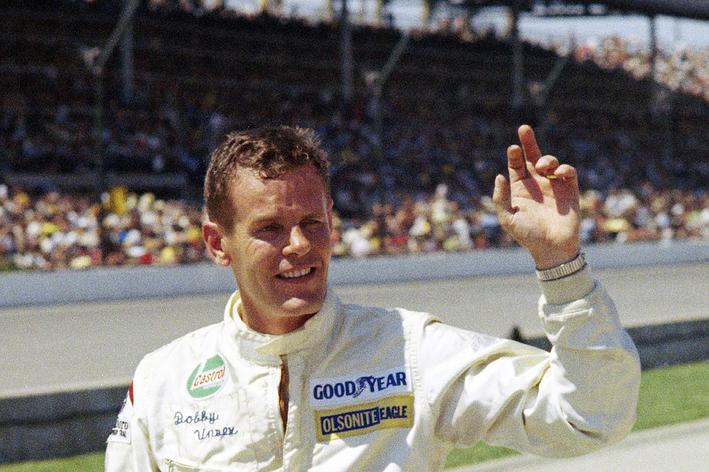 FILE - Auto racer Bobby Unser is shown at the Indianapolis 500 auto race in Indianapolis, Ind., in this May 30, 1971, file photo. Three-time Indianapolis 500 winner Bobby Unser has died. He died of natural causes at his home in Albuquerque, New Mexico, on Sunday, May 2, 2021. He was 87. (AP Photo/Chuck Robinson, File)