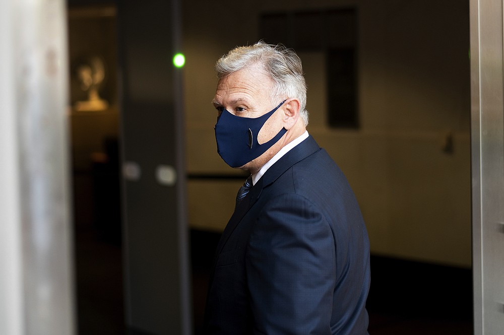 Phil Schiller, an Apple executive, enters the Ronald V. Dellums building in Oakland, Calif., on Monday, May 3, 2021, to attend a federal court case brought by Epic Games. Epic, maker of the video game Fortnite, charges that Apple has transformed its App Store into an illegal monopoly. (AP Photo/Noah Berger)