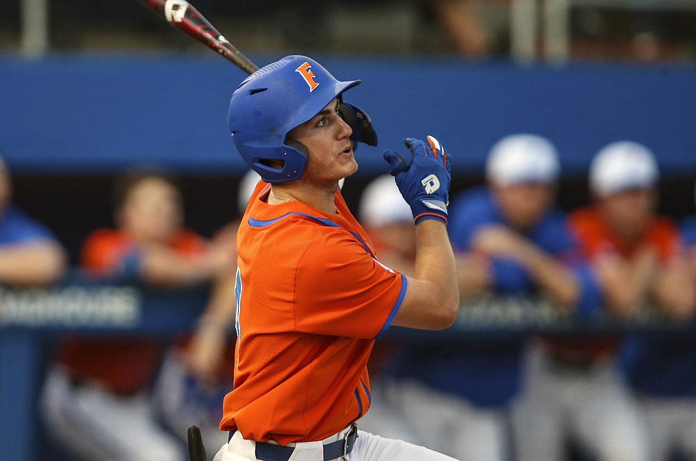 FILE - Florida outfielder Jud Fabian bats during an NCAA college baseball game against Florida A&M in Gainesville, Fla., in this Wednesday, March 4, 2020, file photo. Fabian is tied for second in the nation with 16 home runs. (AP Photo/Gary McCullough, File)